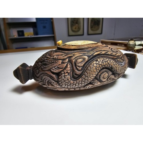 306 - An interesting antique Chinese hand carved wooden snuff box with a carved bone insert to the lid and... 