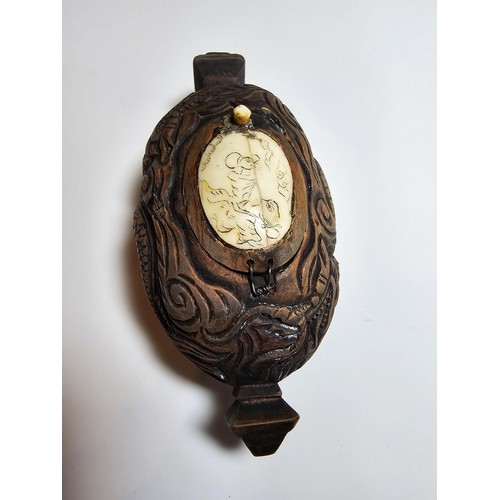 306 - An interesting antique Chinese hand carved wooden snuff box with a carved bone insert to the lid and... 