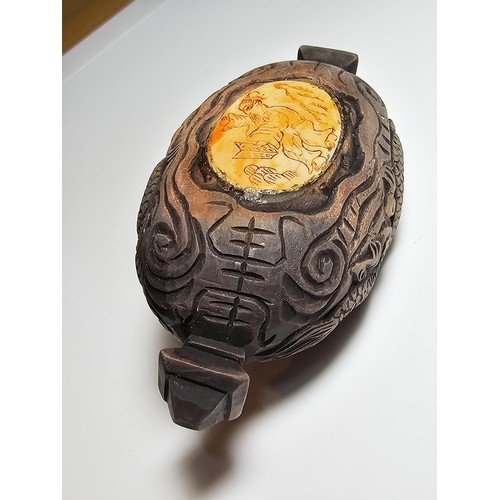 306 - An interesting antique Chinese hand carved wooden snuff box with a carved bone insert to the lid and... 