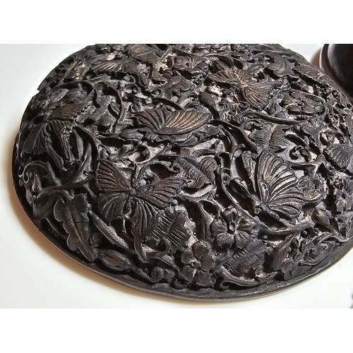 307 - Stunning carved lidded box depicting scenes of butterflies and flowers, made out of resin giving the... 