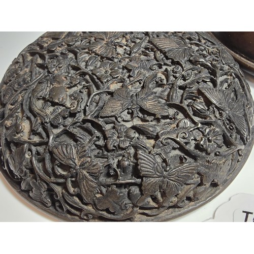 307 - Stunning carved lidded box depicting scenes of butterflies and flowers, made out of resin giving the... 