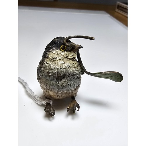 309 - Fine quality cold painted Bronze bird holding a sycamore seed figure in the style of Franz Bergman, ... 