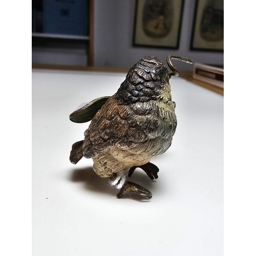 309 - Fine quality cold painted Bronze bird holding a sycamore seed figure in the style of Franz Bergman, ... 