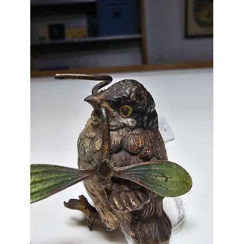 309 - Fine quality cold painted Bronze bird holding a sycamore seed figure in the style of Franz Bergman, ... 