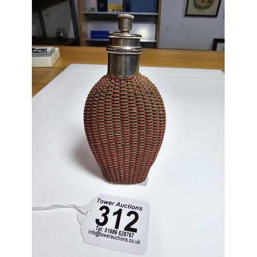 312 - Good quality antique Perfume / scent bottle wrapped in rattan weave featuring a dispensing lid marke... 