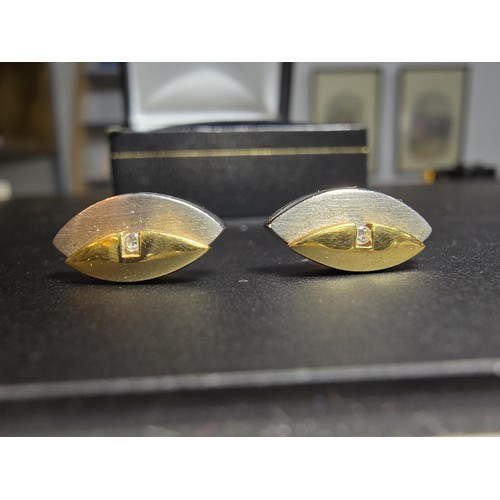 318 - Pair of 14ct Yellow and White Gold Stud earrings, both inset with a small Diamond with 9ct Gold butt... 