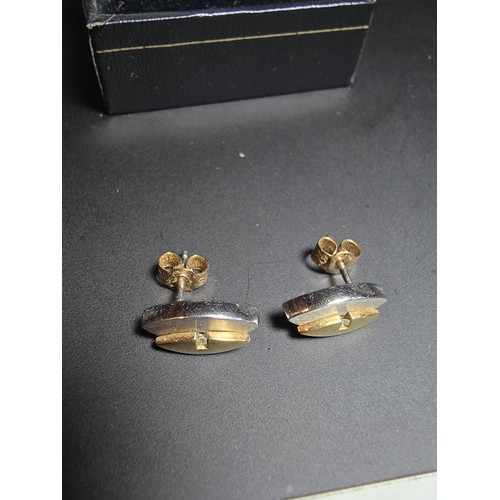 318 - Pair of 14ct Yellow and White Gold Stud earrings, both inset with a small Diamond with 9ct Gold butt... 