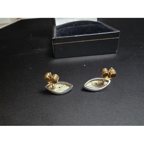 318 - Pair of 14ct Yellow and White Gold Stud earrings, both inset with a small Diamond with 9ct Gold butt... 