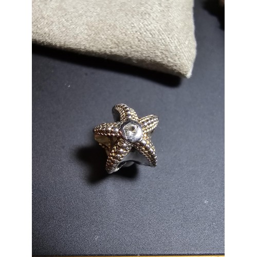 324 - Genuine Clogau 925 Silver Starfish charm featuring Clogau Gold inset with a clear Topaz stone in its... 