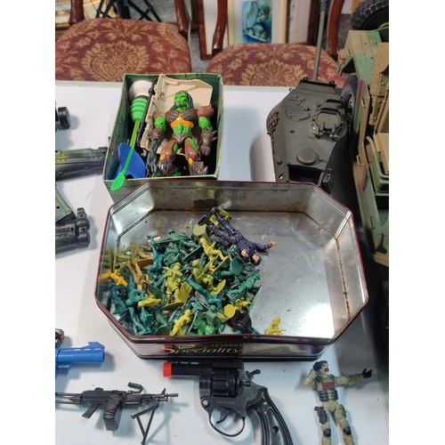 97 - Crate containing a large quantity of military related toy figures inc soldiers, variety of guns, tan... 