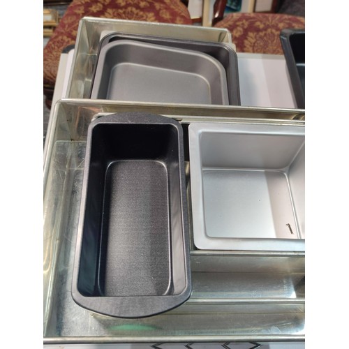 98 - Box containing a large quantity of good quality non stick cake tins inc a t-shirt shaped tin, pyrex ... 