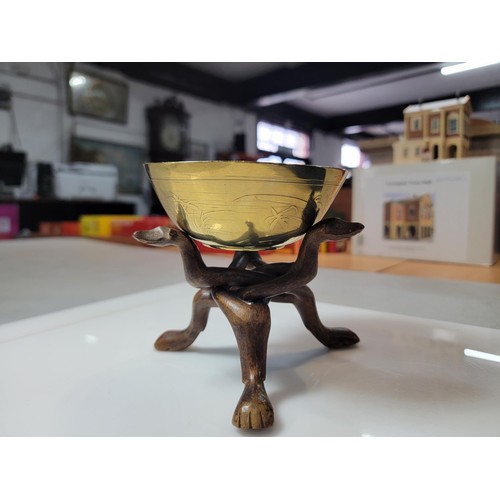 333 - Vintage Asian Bronze bowl on a carved wood 3 leg stand, in good order. Height 11.5cm Width 11.5cm