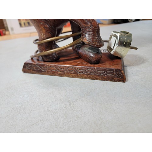 346 - A beautifully carved solid wood Elephant formed lamp with wicker shade. A good statement piece prese... 