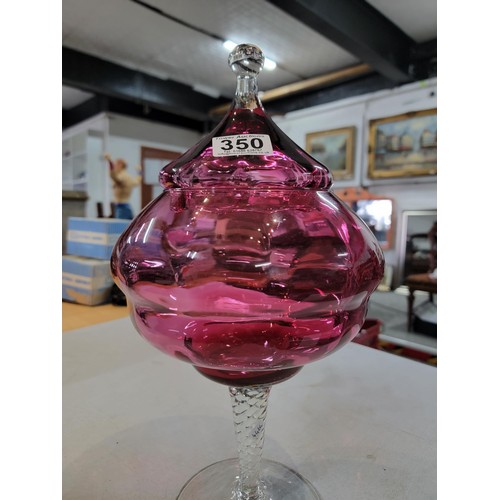 350 - Vintage Large and impressive Cranberry glass lidded bon bon dish on a long clear glass footed base, ... 