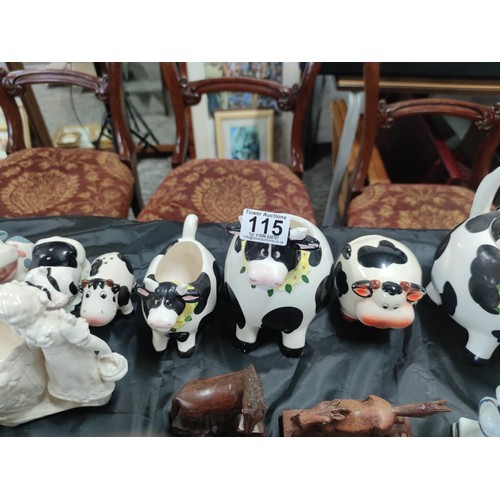 115 - 2x boxes containing a large quantity of collectables inc a quantity of cow formed items inc sugar bo... 