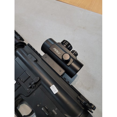 355 - A good assault rifle style airsoft gun fitted with apinty 1X40RD scope and a B&T silencer, complete ... 