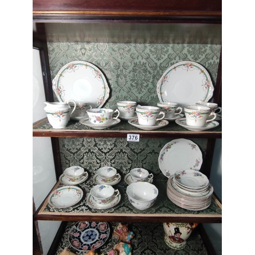 376 - A part tea set of Clifton china in Nancy design along with Heathcote china tea cups and saucers.