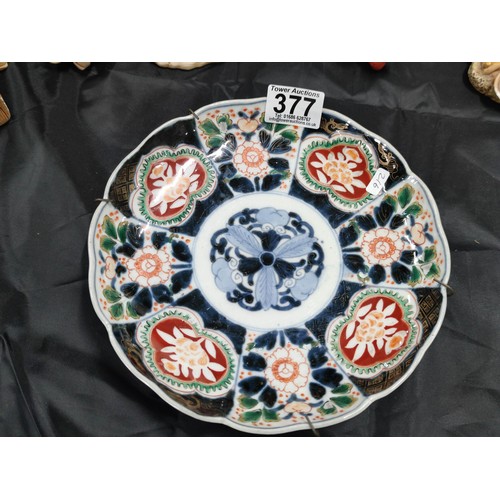 377 - A selection of collectables to include an antique Chinese scallop rimmed plate with thick enamel pai... 