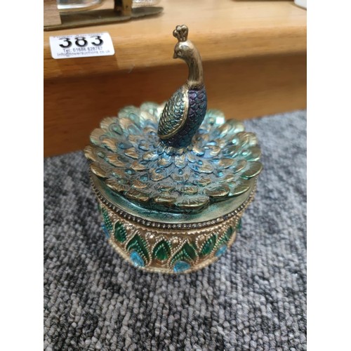 383 - A large quantity of collectable trinket boxes to include a jewelled peacock formed trinket box, deco... 