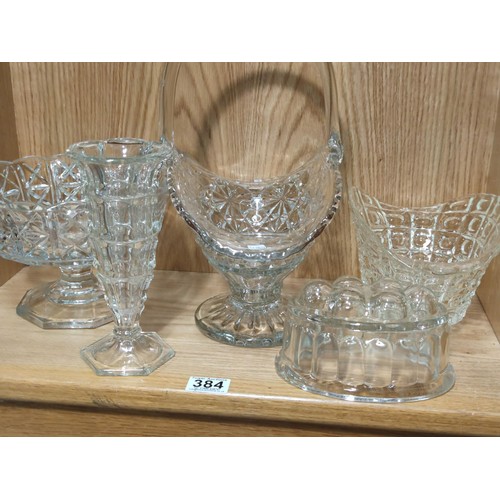 384 - A quantity of heavy quality glass table items to include a large trifle bowl, 2x glass formed fruit ... 