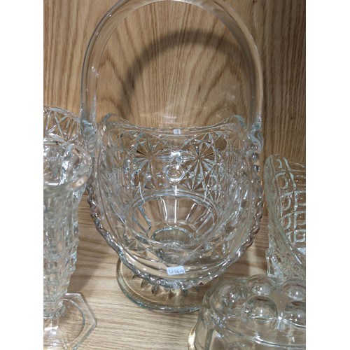 384 - A quantity of heavy quality glass table items to include a large trifle bowl, 2x glass formed fruit ... 