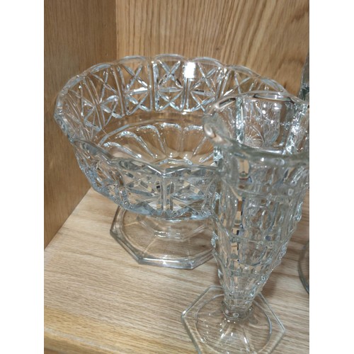 384 - A quantity of heavy quality glass table items to include a large trifle bowl, 2x glass formed fruit ... 