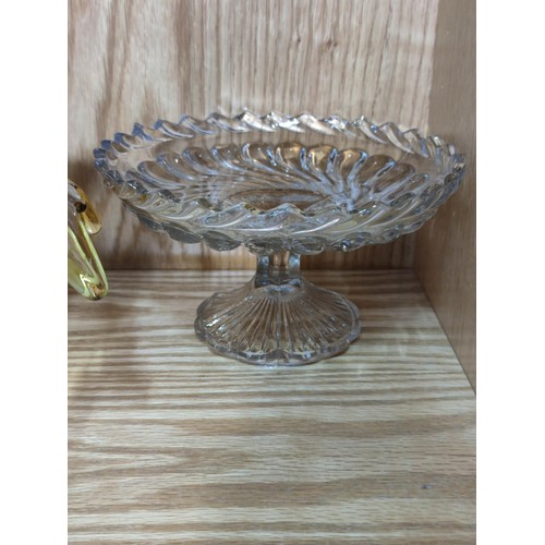 384 - A quantity of heavy quality glass table items to include a large trifle bowl, 2x glass formed fruit ... 