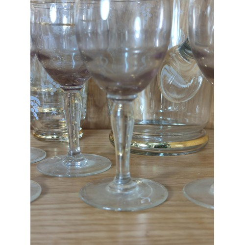 386 - A quantity of vintage glassware to include 2 gold rimmed and etched jugs with 12 matching glasses al... 