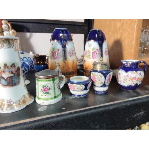 388 - A large quantity of various collectable items to include various china and glass bells, Wedgwood ite... 