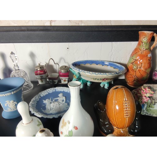 388 - A large quantity of various collectable items to include various china and glass bells, Wedgwood ite... 