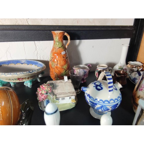 388 - A large quantity of various collectable items to include various china and glass bells, Wedgwood ite... 