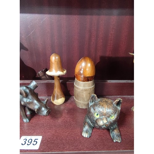 395 - A quantity of treen and black forest items to include black forest inkwell with glass eyes and compl... 