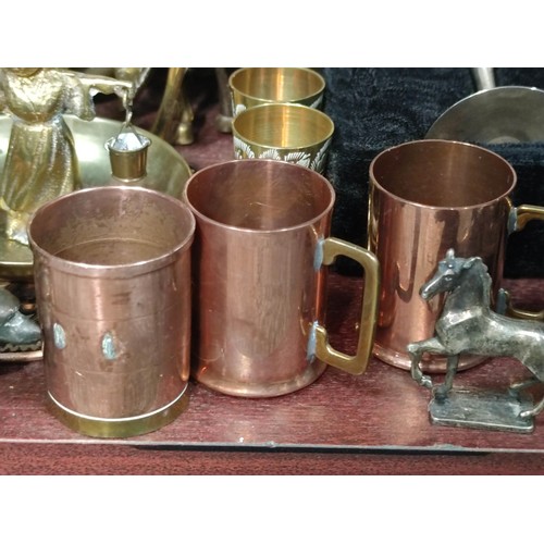 398 - A very large quantity of mostly collectable brass items to include candlesticks, a traditional Welsh... 