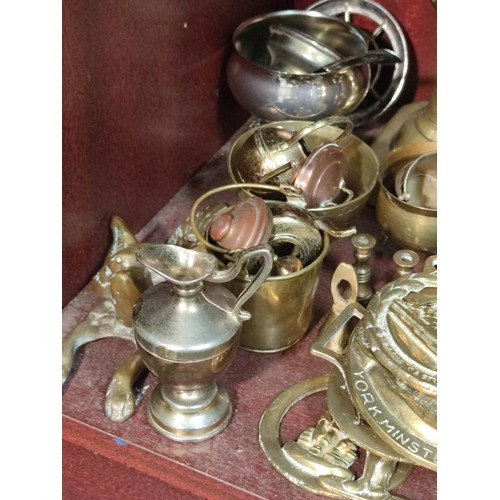 398 - A very large quantity of mostly collectable brass items to include candlesticks, a traditional Welsh... 