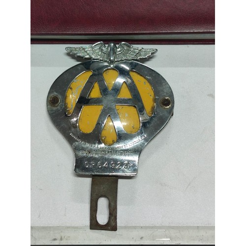 402 - An early vintage AA car badge along with an AA 50th year anniversary atlas, complete with original m... 