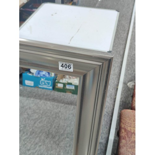 406 - 2 framed large wall mirrors, 1 with a silver frame the other in natural wood. Largest measures 1m an... 