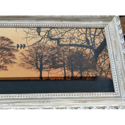 413 - A wide rectangular white distressed framed Canvas print of a sunset scene with a 3D step design. Len... 