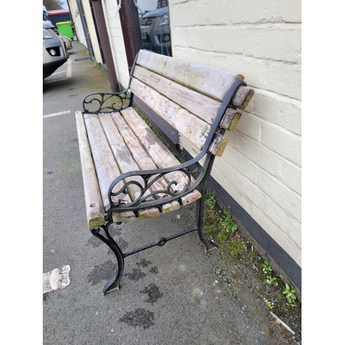 576 - Cast iron ended park bench with good thick timbers to seat and back nice and sturdy with great patin... 