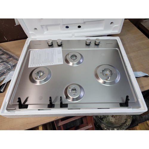 479 - A new and unused Hotpoint hob unit, complete with integral stainless steel hob and accessories