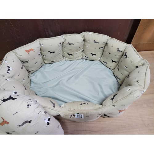 498 - Good quality padded pet bed in good order with dog pattern measures 64cm