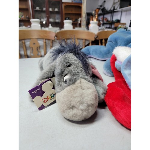 8 - 3x Disney Eeyore soft toys to include 1x large Eeyoreby Jemini, a christmas stocking Eeyore and 1x o... 