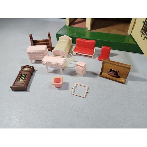 11 - Vintage 1950s Tri-ang wooden dolls house featuring metal framed windows, semi-timbered gables, and r... 