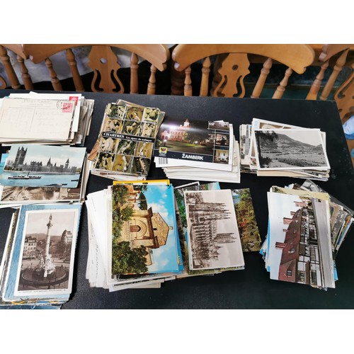 155 - Box containing a very large quantity of various postcards from the UK and around the world some with... 