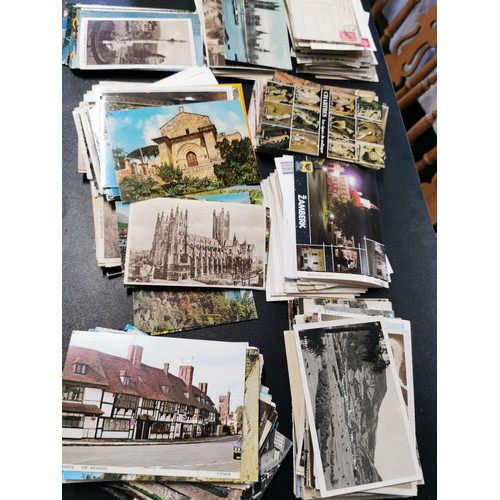 155 - Box containing a very large quantity of various postcards from the UK and around the world some with... 