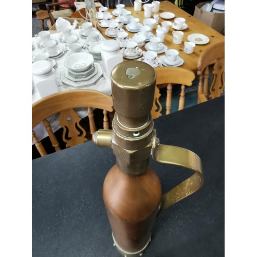 163 - An antique copper and brass fire extinguisher stamped E4 in excellent condition, stands at 45cm high... 