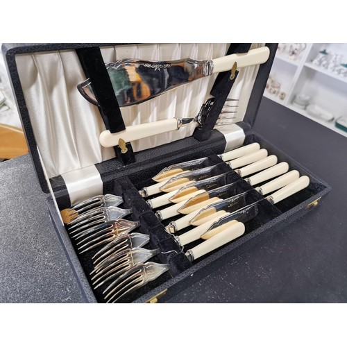 165 - A quantity of boxed plated cutlery including a boxed fish set for 6 persons, a boxed soup spoon set ... 