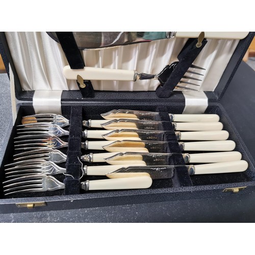 165 - A quantity of boxed plated cutlery including a boxed fish set for 6 persons, a boxed soup spoon set ... 