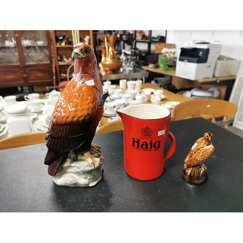 168 - A Beswick golden eagle decanter containing Beneagles whisky, a carltonware high whisky jug and a sma... 