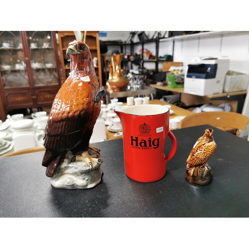 168 - A Beswick golden eagle decanter containing Beneagles whisky, a carltonware high whisky jug and a sma... 