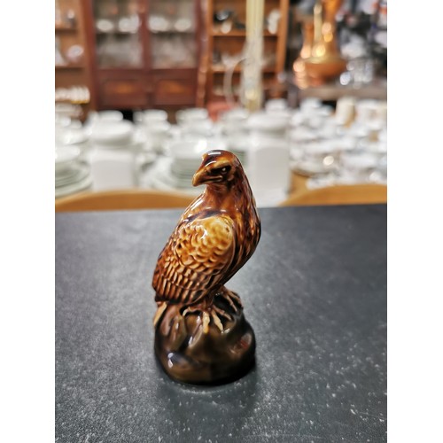 168 - A Beswick golden eagle decanter containing Beneagles whisky, a carltonware high whisky jug and a sma... 